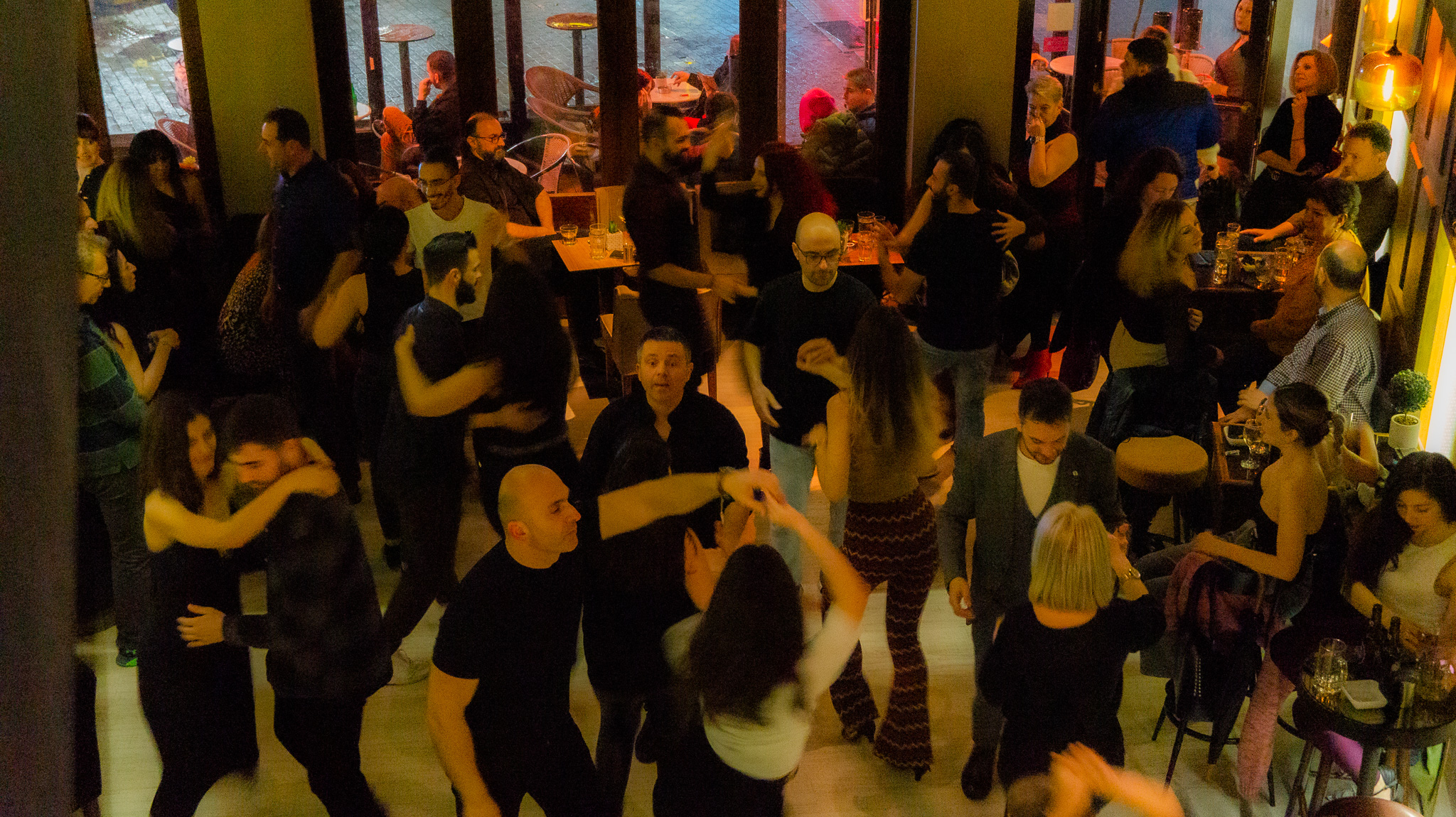 Vibrant salsa social dancing event at Latin Grow with students practicing Latin dance moves in Alexandroupolis